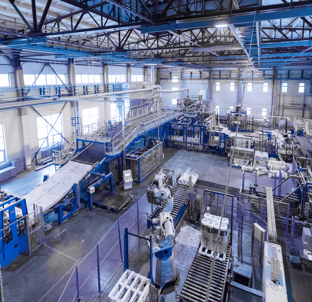 Factory workshop interior and machines on glass production background